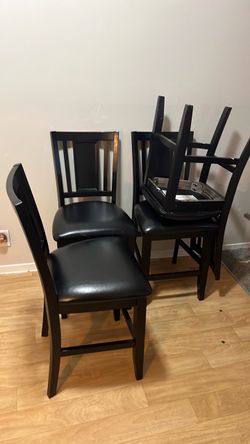 4 Black wooden chairs