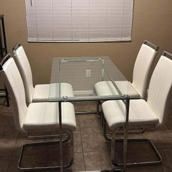 Glass dining table  with UNOPENED chairs