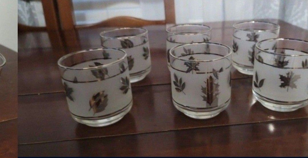 Mid century frosted glasses accented with fall silver leaf pattern. Measures 2 7/8” diameter x 3 1/8” high