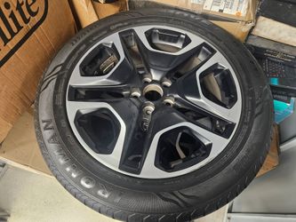 4 OEM RAV4 Adventure wheels with tires and spare tire kit.