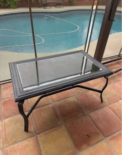 Glass and black or dark gray metal patio outdoor coffee table