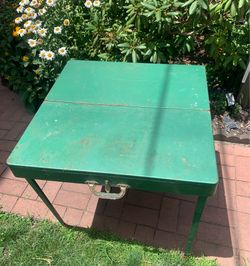 Coleman Rare 1960's  Metal Folding  Table Green  with handle has a little rust on the underside Legs and table lock in place