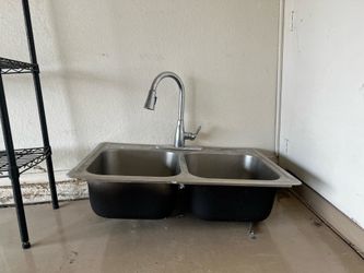 Kitchen sink with newly installed faucet