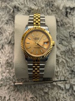 ($100) Rolex