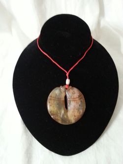 A CHINESE GOOD LUCK JADE PENDANT