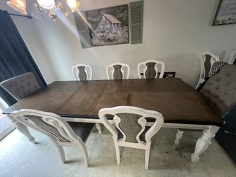 Almost New Table With 9 Chairs And 2 Leafs Make Offer