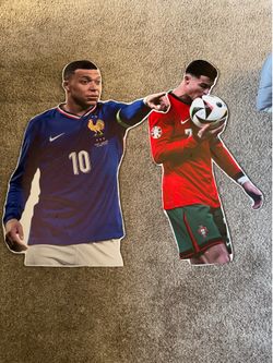 Wood cut outs Cristiano Ronaldo and Mbappe