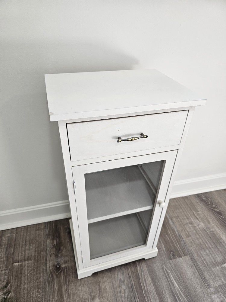 Great condition, barely used, White cabinet. Wood and glass.