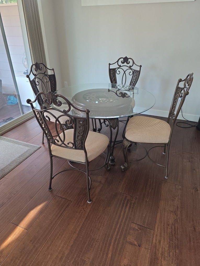 Glass Dining Table With Six Metal-frame Chairs