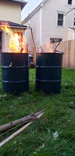 Brand new 55 gallon barrels with tops