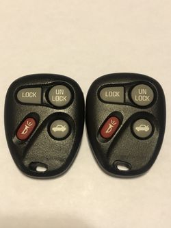 A pair of GM / LEAR keyless entry fobs part # 10443537