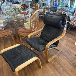 IKEA POÄNG armchair with a birch veneer frame and black leather cushions