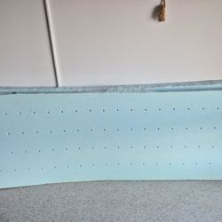 A mattress cut into two pieces.