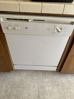 GE Electric Stove, GE Dishwasher, and Whirlpool Refrigerator good condition.