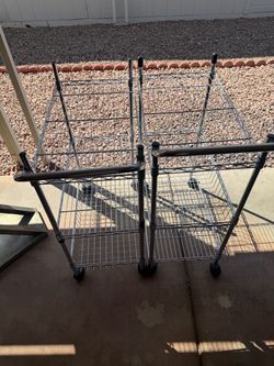 2  metal carts with shelves, and wheels