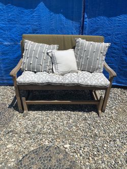 Teak rocking bench with cushions. Paid 500 for it SOLID TEAK