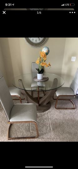 Beautiful rose gold glass table 4 seater