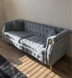 Gray blue velvet sofa with gold legs