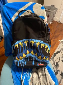 Spray ground backpack with tags