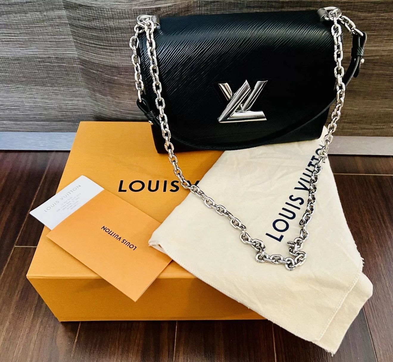 Louis Vuitton Black EPI Leather Twist MM Shoulder Bag Silver HDW $4850 plus tax The Louis Vuitton Black EPI Leather Twist MM Shoulder Bag is a medium