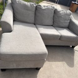 Gray Sectional.   $275.  Delivered Available Small Fee 