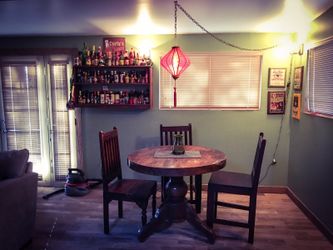 Solid and very heavy wood, round table and 3 hand carved chairs