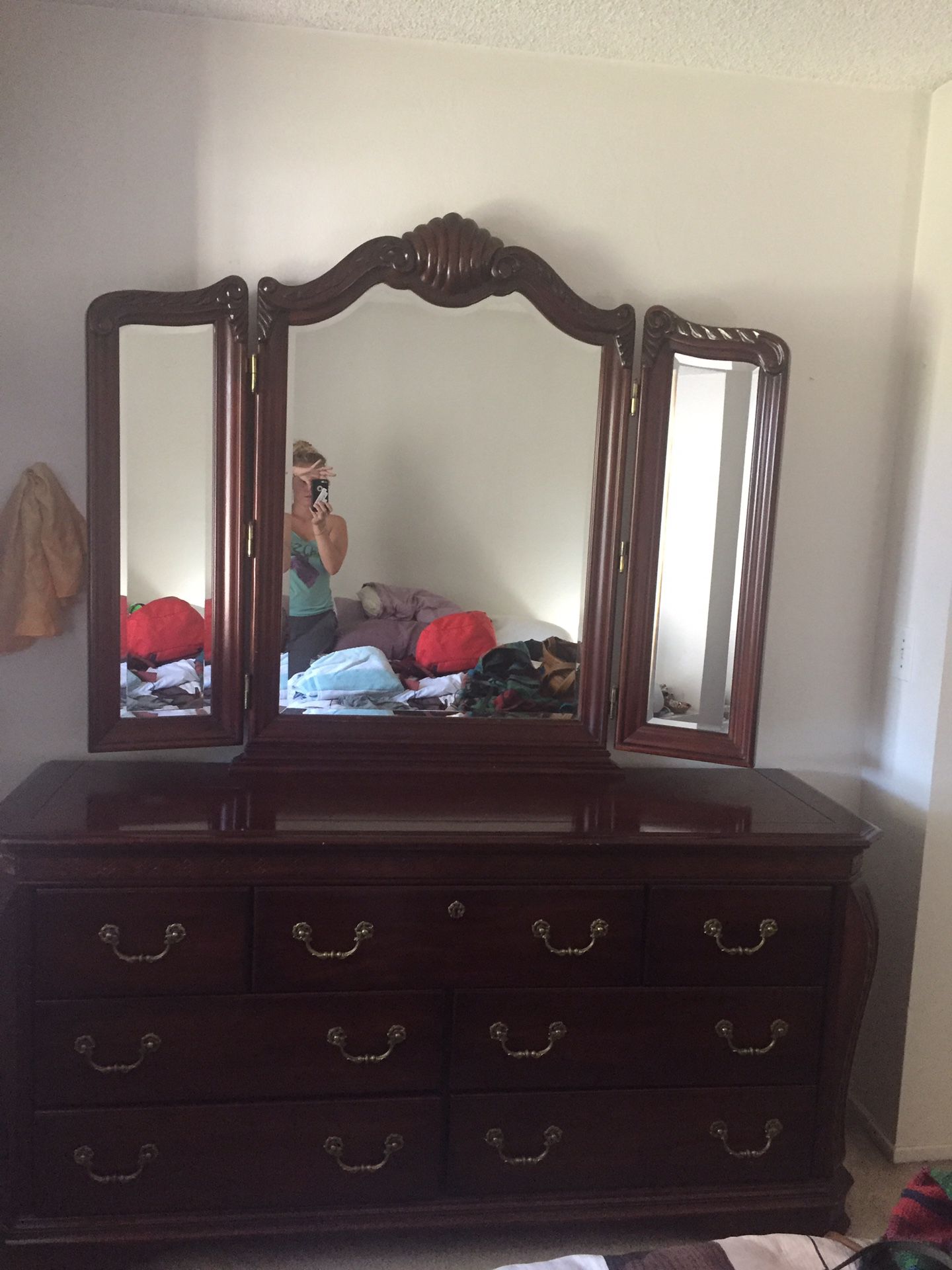 Wooden dresser with mirror and two nightstands
