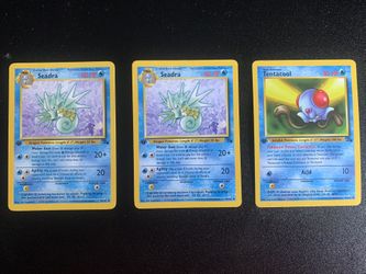 Two Seadra 1st edition Pokémon Card 1999 42/62 And One Tentacool 56/62