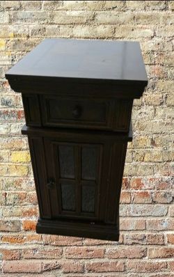 Wooden end table with a built-in charging station.
