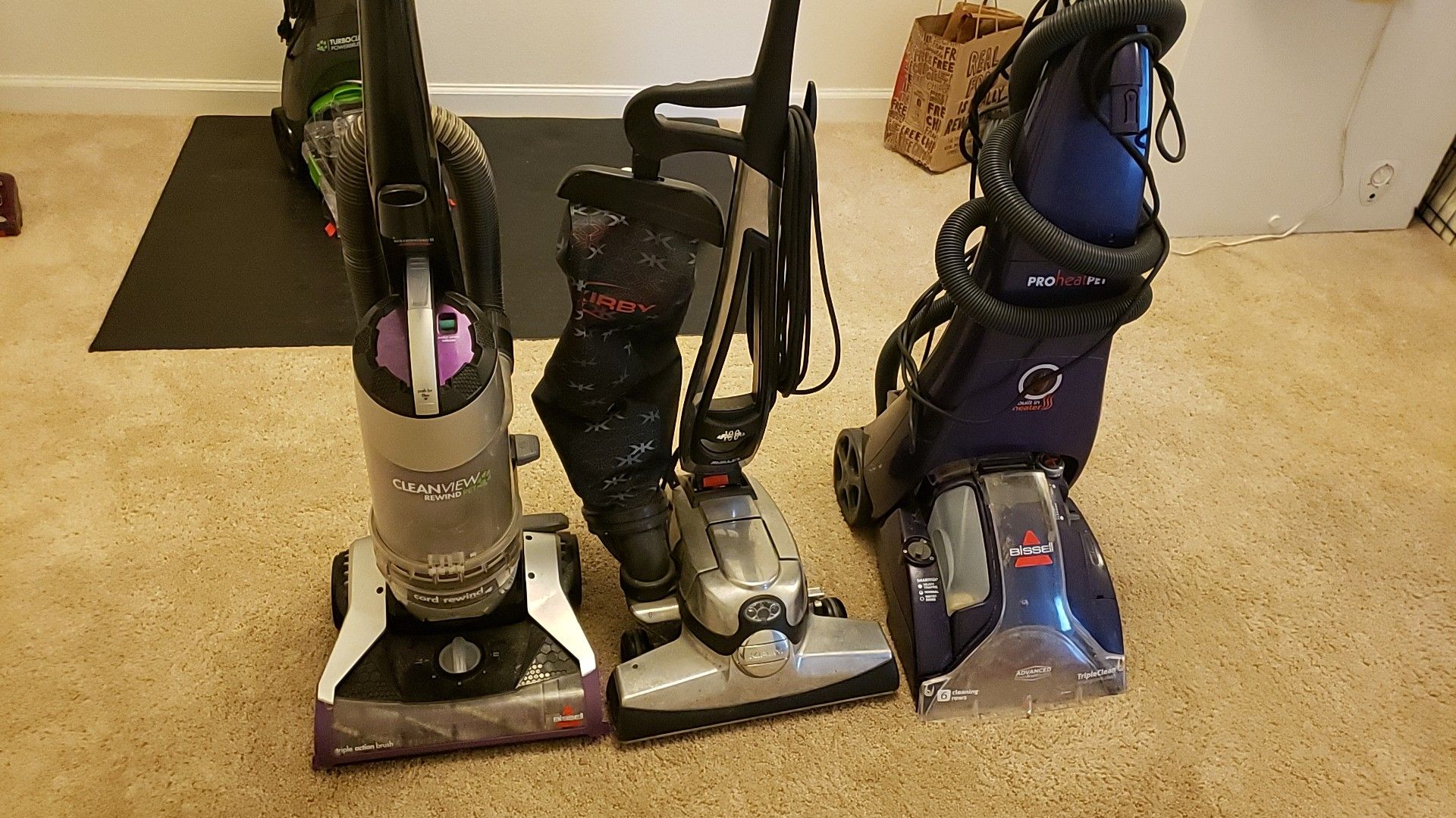 2 vacuum cleaners and 1 steam cleaner