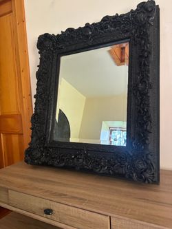 Ornate black mirror