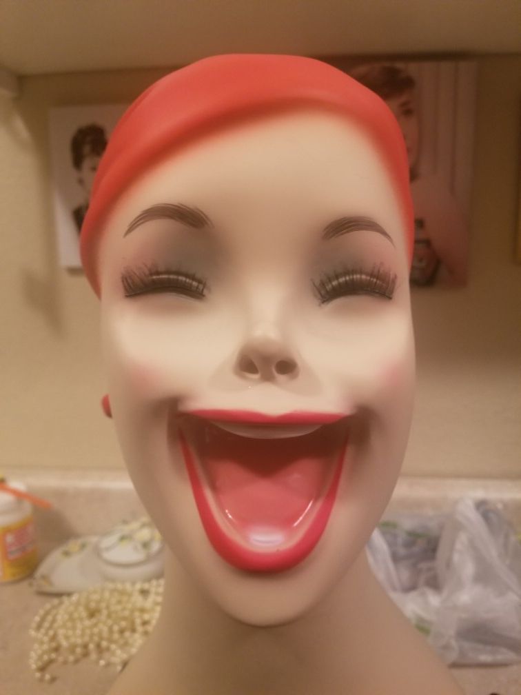 Laughing red head mannequin bust