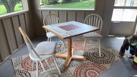 Game table with chairs. Perfect for playing chess, etc..