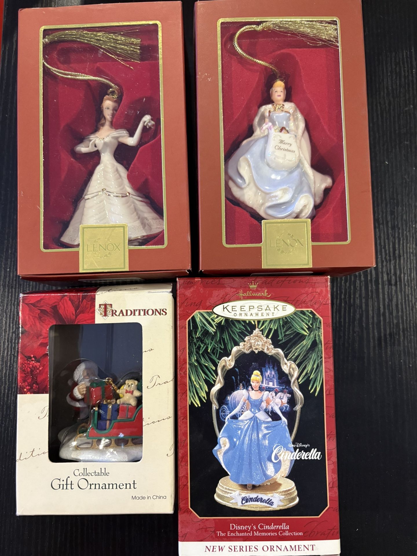 3 Princess Ornaments Still In The Boxes And 1 Santa In The Box.