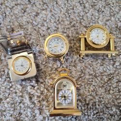 collection,four mini brass clocks, shadow box items