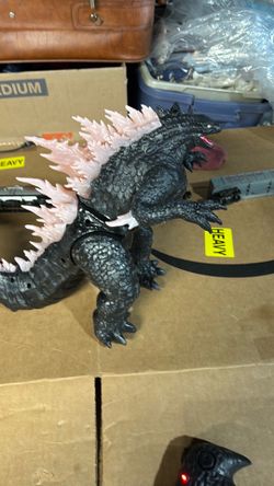 Got Godzilla, Godzilla Godzilla Godzilla he blows fire. He lights up and he walks, and he makes lots of noise.
