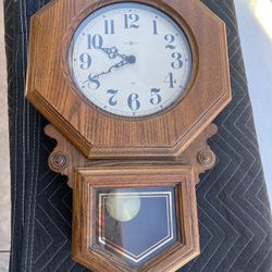 Howard miller clock company wall clock with pendulum in very good condition