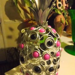 Metal pineapple,it's pink black and silver,$10