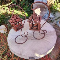 2 Wrought Iron outdoor decorative plant/candle holders in good cond pick up  or delivery as is. 