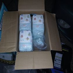 Two Boxes Of Baby Diapers