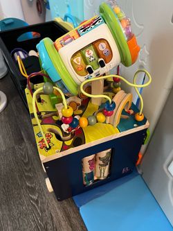 Wooden activity cube and Vtech roll, drum and discover toy