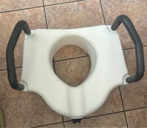 Raised toilet seat with handles
