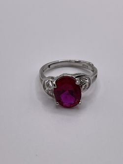 A lab created ruby ring on sterling silver with an adjustable band.