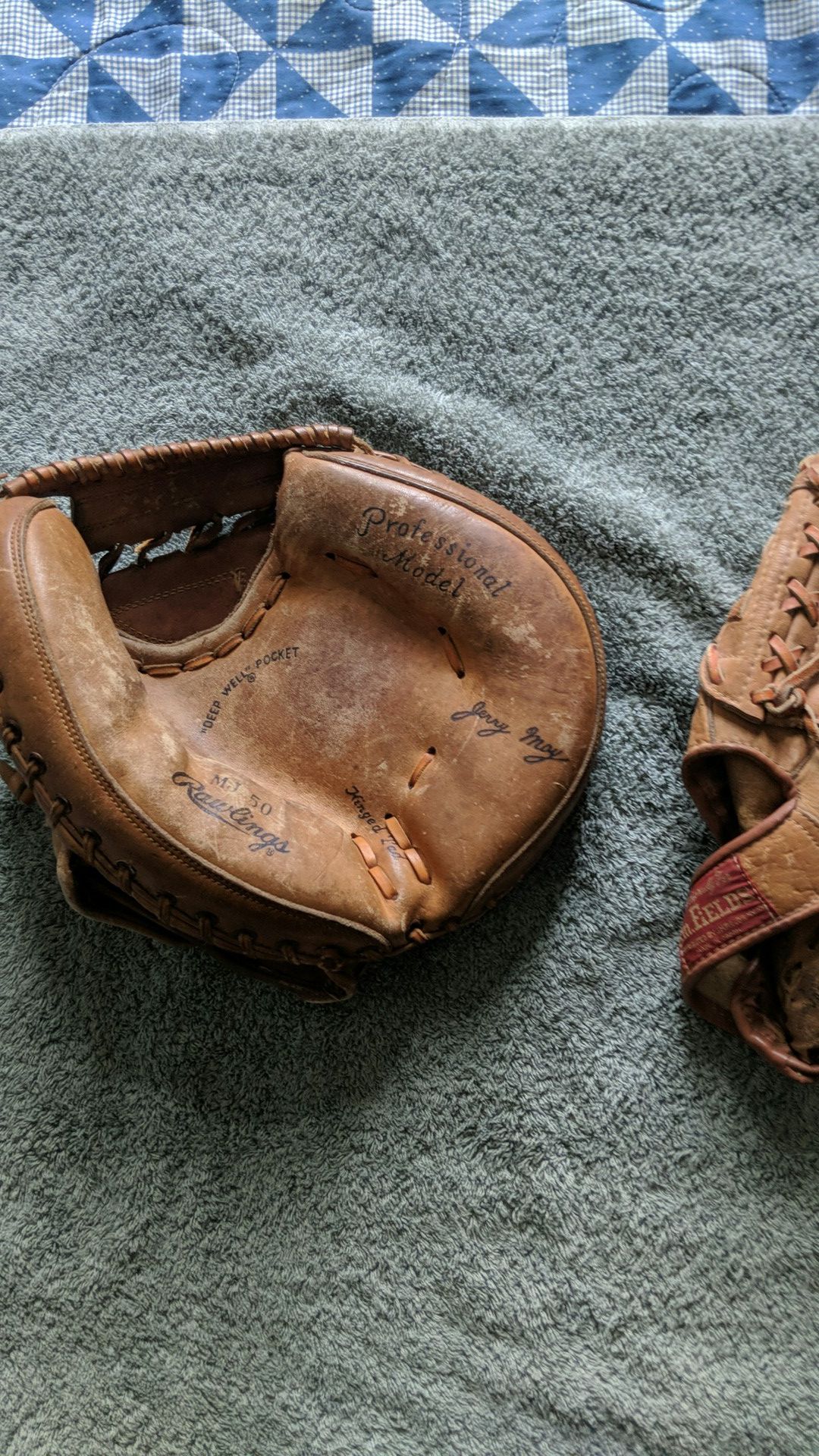 Two vintage style baseball gloves. Catchers mitt and fielders glove.