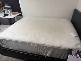 Queen bed with frame , covered with Mattress sheet