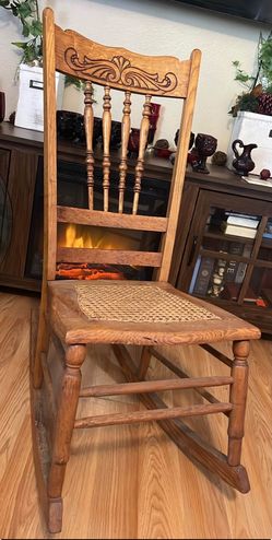 Antique Oak Pressed-Back Rocking Chair with Cane Seat (Circa 1900)