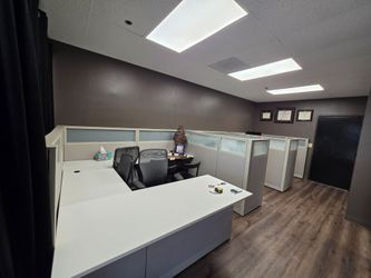 5 cubicles with desks