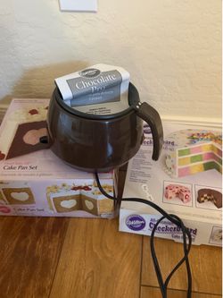 Baking tins and chocolate melting pot