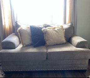 Brown With Silver Studs At The Bottom.