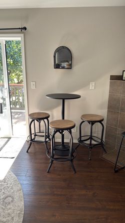 Bar table with adjustable stools